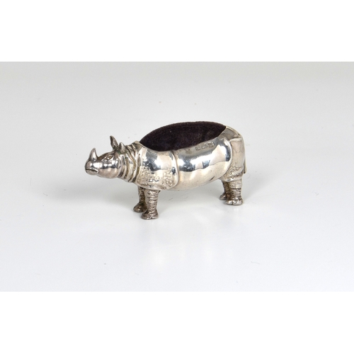 45 - A rare Edwardian novelty silver rhinoceros pin cushion, makers mark worn, Birm. 1908, modelled stan... 