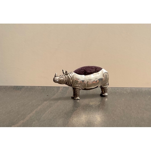 45 - A rare Edwardian novelty silver rhinoceros pin cushion, makers mark worn, Birm. 1908, modelled stan... 