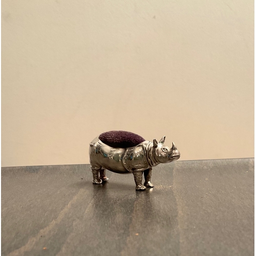 45 - A rare Edwardian novelty silver rhinoceros pin cushion, makers mark worn, Birm. 1908, modelled stan... 