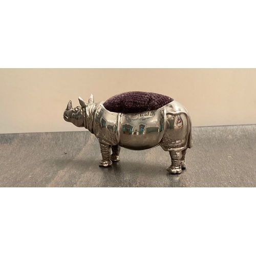 45 - A rare Edwardian novelty silver rhinoceros pin cushion, makers mark worn, Birm. 1908, modelled stan... 