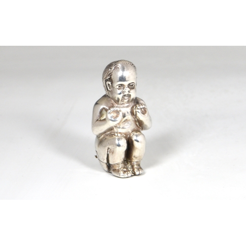 50 - A Victorian novelty silver vesta case fashioned as a boy crouching / on potty, Sampson Mordan & Co, ... 