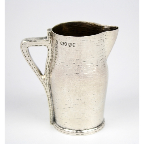 68 - An extremely rare Victorian novelty silver cream jug, Edward Hutton, London 1887, modelled as a leat... 