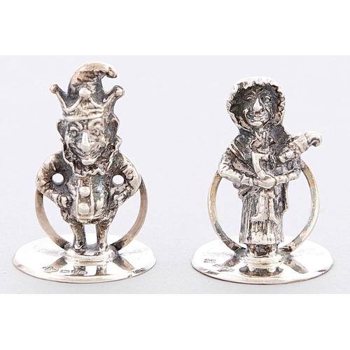 74 - A pair of George V Mr and Mrs Punch novelty cast silver menu / card holders, Horace Woodard & Co Ltd... 