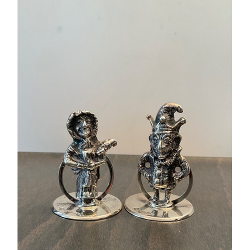 74 - A pair of George V Mr and Mrs Punch novelty cast silver menu / card holders, Horace Woodard & Co Ltd... 