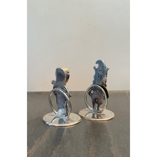 74 - A pair of George V Mr and Mrs Punch novelty cast silver menu / card holders, Horace Woodard & Co Ltd... 