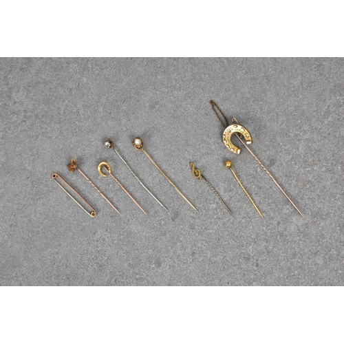 820 - Eight antique stick and tie pins, (some gold), to include a 18ct gold foxes head & 18ct gold miniatu... 