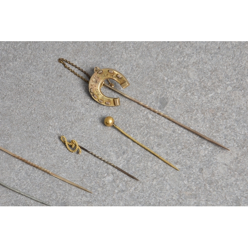 820 - Eight antique stick and tie pins, (some gold), to include a 18ct gold foxes head & 18ct gold miniatu... 