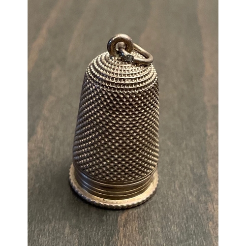 97 - A rare antique white metal / silver novelty thimble scent bottle holder and seal pendant, Probably l... 