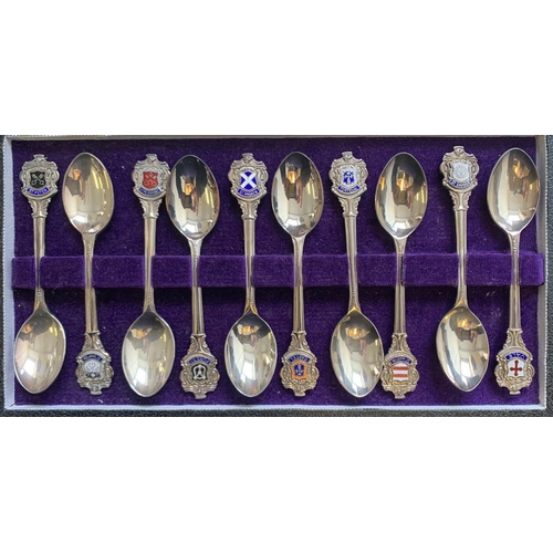 117 - A cased set of ten Channel Islands silver and enamel Guernsey parish coffee spoons, each with parish... 