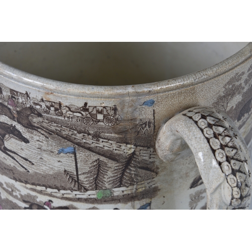 10 - A 19th century twin handled loving cup of large proportions, transfer printed and hand coloured, dep... 