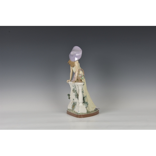 103 - A large Lladro figurine 'Time for Reflection', young lady modelled standing, leaning against balustr... 