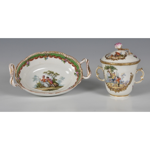 112 - A Berlin porcelain two-handled chocolate cup and cover, finely painted with two scenes in gilded hal... 