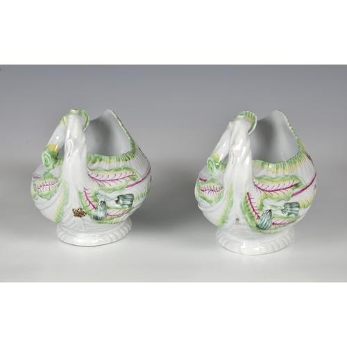 113 - A pair of Worcester porcelain lettuce leaf sauce boats, probably first period, with moulded leaf tex... 