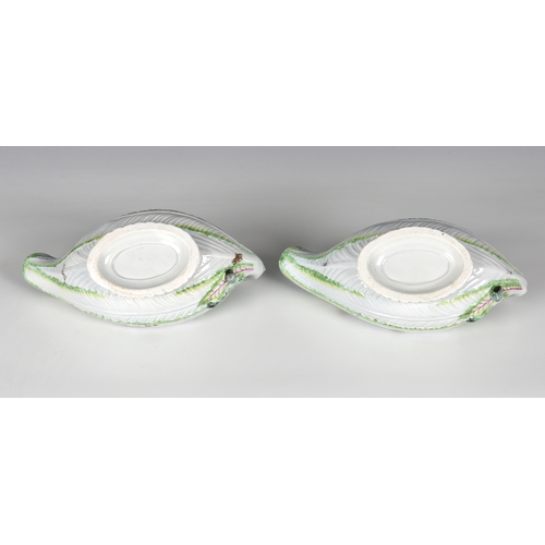 113 - A pair of Worcester porcelain lettuce leaf sauce boats, probably first period, with moulded leaf tex... 