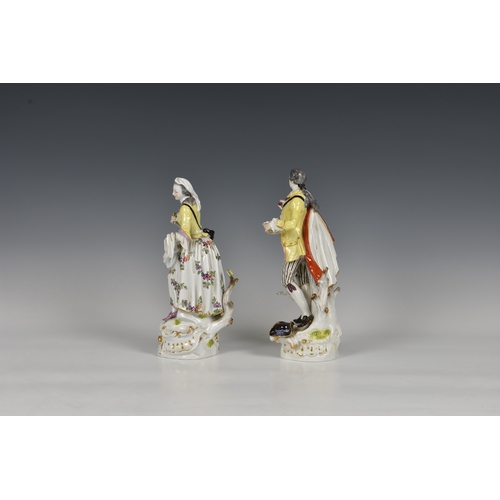 118 - A pair of Meissen figures of a gallant and his companion, early 20th century, the man holding a bask... 