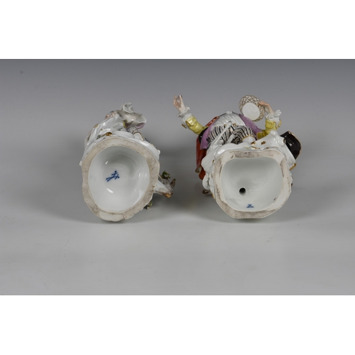 118 - A pair of Meissen figures of a gallant and his companion, early 20th century, the man holding a bask... 