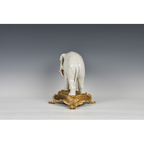 12 - An ormolu mounted Sampson white porcelain elephant , after Meissen, 19th century, realistic features... 