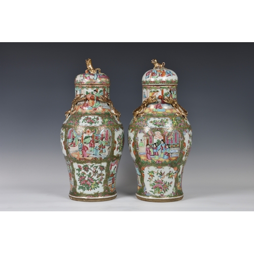 1247 - A closely matched pair of 19th century Chinese Canton famille rose covered vases, the vases of balus... 