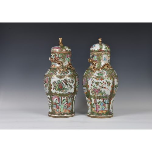 1247 - A closely matched pair of 19th century Chinese Canton famille rose covered vases, the vases of balus... 