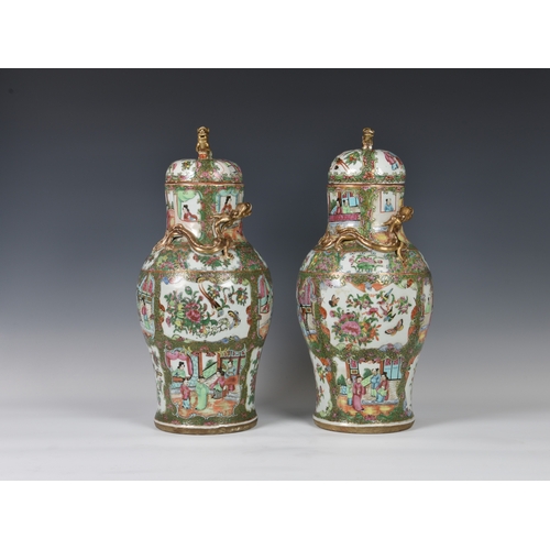 1247 - A closely matched pair of 19th century Chinese Canton famille rose covered vases, the vases of balus... 