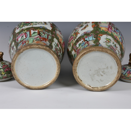 1247 - A closely matched pair of 19th century Chinese Canton famille rose covered vases, the vases of balus... 