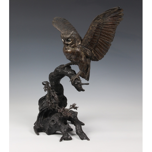 1250 - A Japanese silvered bronze okimono of an owl, Meiji period (1868-1912), the silvered owl with inset ... 