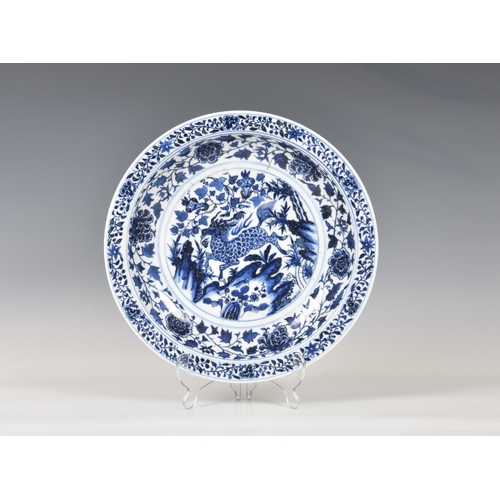 1253 - An unusual mid-20th century blue and white Chinese porcelain dish, with bands of flowers and foliage... 