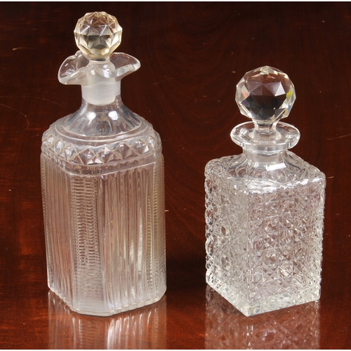 150 - A pair of Georgian oval pint decanters, with panel, diamond and prismatic cut bodies and necks with ... 