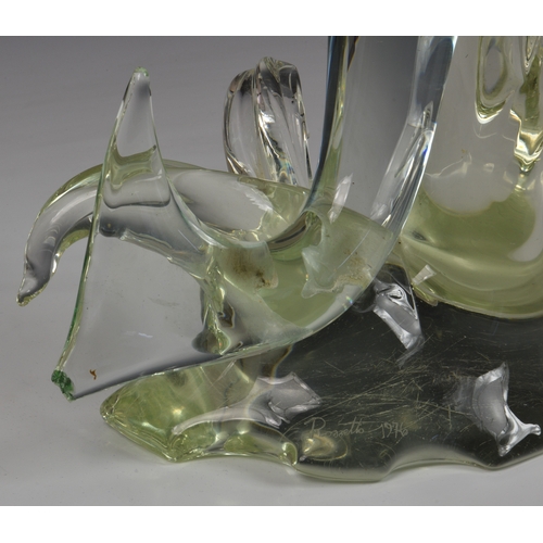 151 - A large Murano glass fish sculpture, signed Rostrato 1976, clear and green glass fish, jumping over ... 