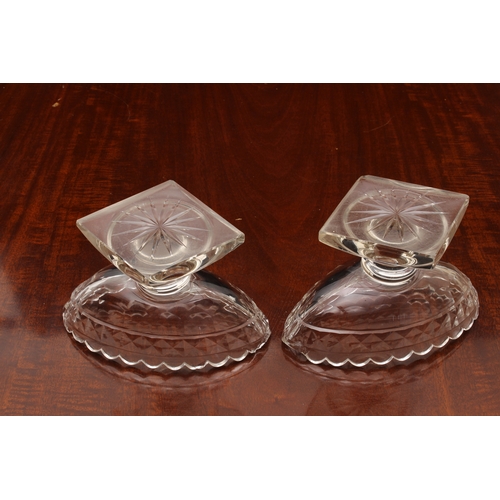 174 - A pair of Georgian cut glass navette pedestal dishes, on knopped stems and raised on round stepped b... 