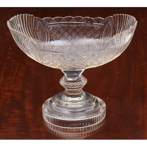 174 - A pair of Georgian cut glass navette pedestal dishes, on knopped stems and raised on round stepped b... 