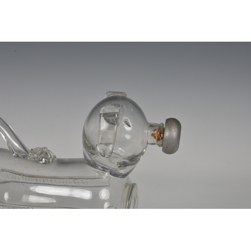 183 - A late 19th century novelty glass decanter fashioned as a dog, his tail forming the handle and nozzl... 