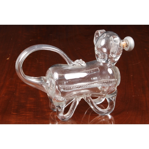 183 - A late 19th century novelty glass decanter fashioned as a dog, his tail forming the handle and nozzl... 