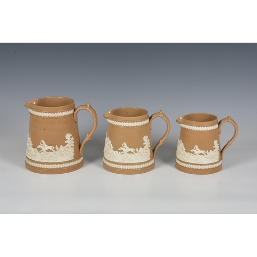 22 - Three Victorian Copeland Late Spode graduated jugs, buff stoneware with sprigged relief decoration o... 