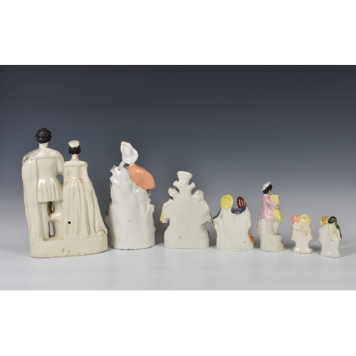 31 - A collection of Staffordshire flatback figures, the largest 'QUEEN & KING OF SARDINIA', 13¼in. (33.6... 