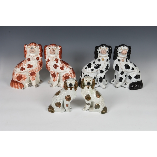 32 - Five pairs of Staffordshire dogs, each pair with traditional embellishments, chain and separated fro... 