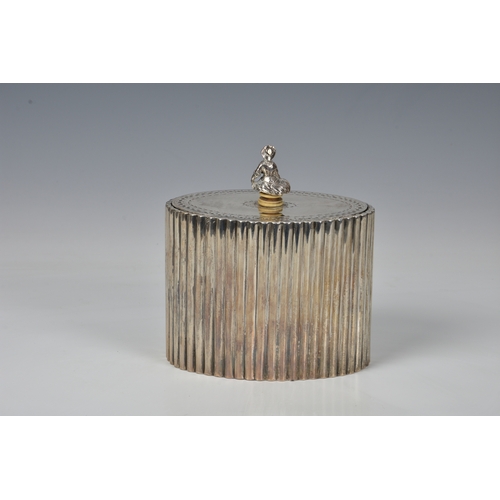 442 - A George III silver tea caddy, Robert Hennell I, London 1784, of reeded, oval form, the hinged lid w... 