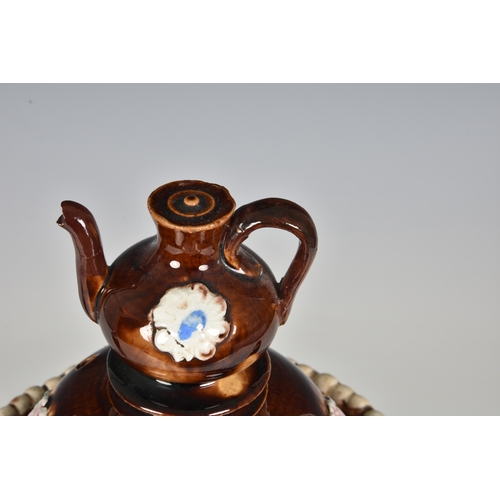 50 - A Victorian barge ware teapot, inscribed "Think of Me", the stoneware body with typical tr... 