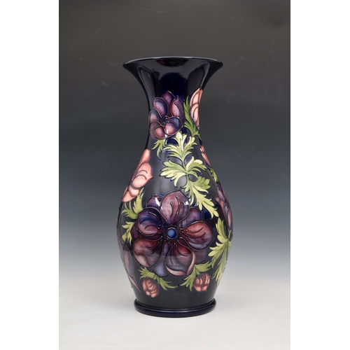 51 - A large Moorcroft Pottery floor standing baluster vase, with flared rim, 'anemone' pattern, on blue/... 