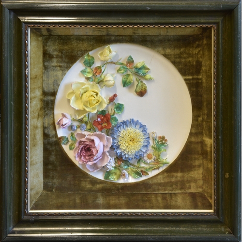 53 - A late Victorian porcelain wall plaque of dished circular form, possibly Moore Brothers, richly appl... 