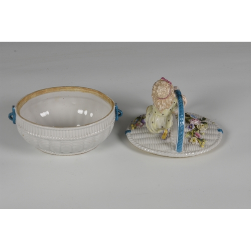 54 - French white porcelain lidded basket, encrusted with coloured flowers and figure of a young girl sea... 