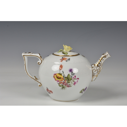 56 - A Herend Teapot, white glaze with hand painted floral design and gilded decoration to handle and spo... 