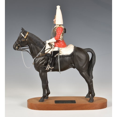 58 - Beswick Porcelain Life guard on Horseback, on a wooden stand. Beswick mark on underside of horse. 14... 