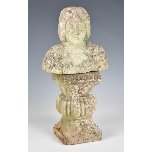 753 - A composite stone bust on a pedestal base, 15½in. (39.4cm.) high. (2)