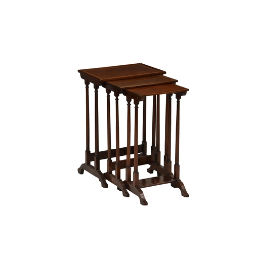 775 - An Edwardian mahogany nest of tables, the crossbanded ebony and boxwood strung tops over slender tur... 