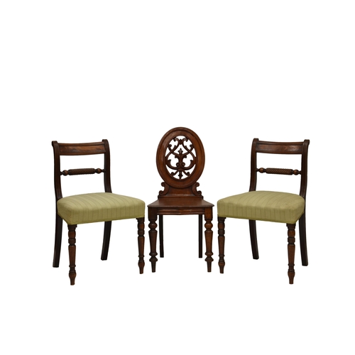 785 - A pair of mahogany side chairs with a mahogany hall chair, the side chairs with a bar back and reede... 