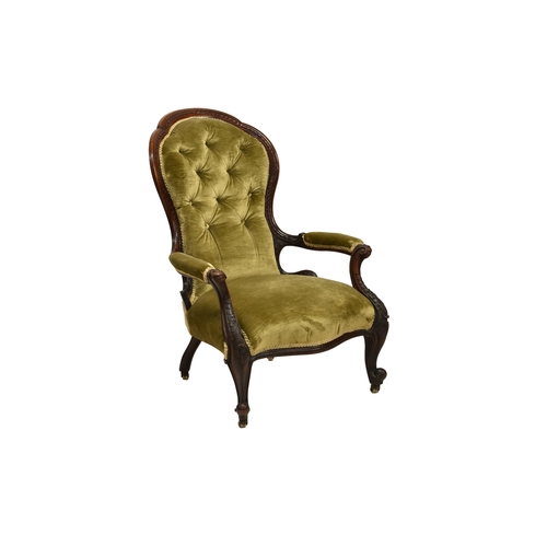 789 - An early Victorian carved walnut showframe open armchair, with a carved back and scroll carved padde... 