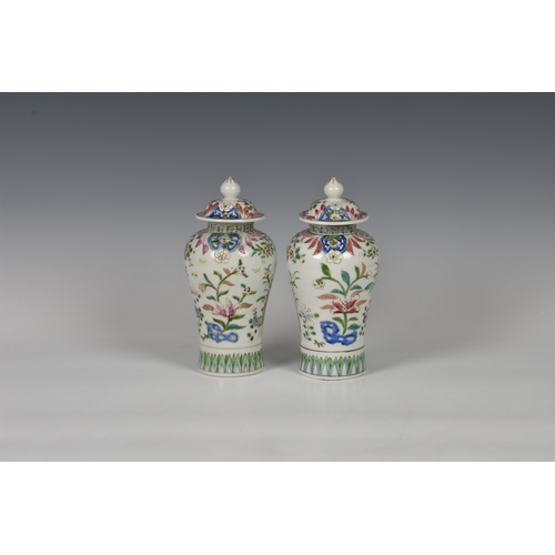 86 - A closely matched pair of 19th century famille rose porcelain covered vases by Samson of Paris, balu... 