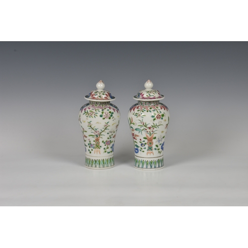 86 - A closely matched pair of 19th century famille rose porcelain covered vases by Samson of Paris, balu... 