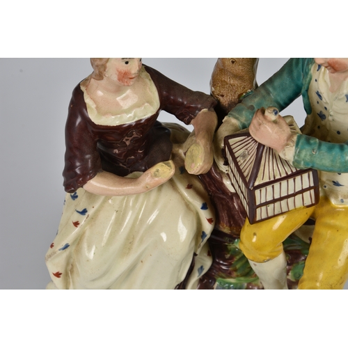 9 - A large Staffordshire Walton style Pearlware pottery figure group, second quarter 19th century, depi... 